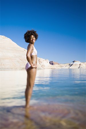 simsearch:640-01358229,k - Young woman in a bikini and standing in water Stock Photo - Premium Royalty-Free, Code: 640-01358822