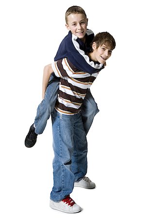 fashion face hair fun - Portrait of a boy riding piggyback on another boy Stock Photo - Premium Royalty-Free, Code: 640-01358842