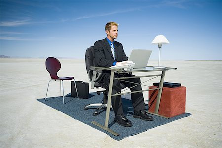 Businessman working on a laptop Stock Photo - Premium Royalty-Free, Code: 640-01358843