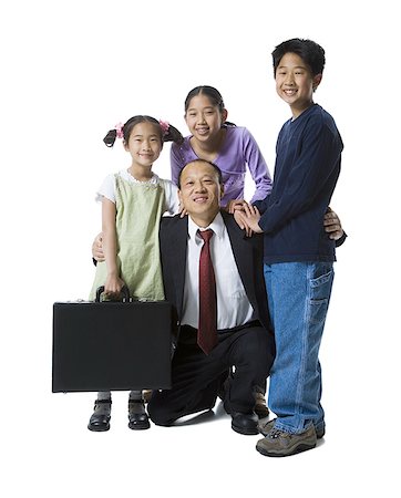 Portrait of a father smiling with his two daughters and son Stock Photo - Premium Royalty-Free, Code: 640-01358997