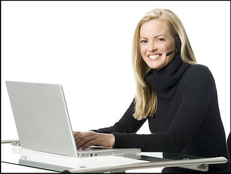 Portrait of a businesswoman working on a laptop Stock Photo - Premium Royalty-Free, Code: 640-01359047