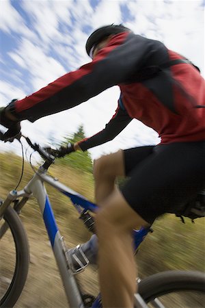 Profile of a mature man cycling Stock Photo - Premium Royalty-Free, Code: 640-01359059