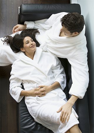 High angle view of an adult woman lying on an adult man's lap Stock Photo - Premium Royalty-Free, Code: 640-01359084