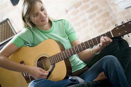 simsearch:640-01365707,k - Teenage girl playing the guitar Stock Photo - Premium Royalty-Free, Code: 640-01359129