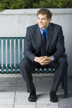 Businessman sitting on a bench Stock Photo - Premium Royalty-Free, Code: 640-01359207