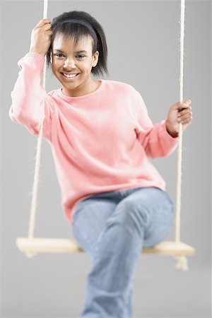 simsearch:400-04847852,k - Portrait of a teenage girl sitting on a swing Stock Photo - Premium Royalty-Free, Code: 640-01359388