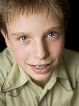 simsearch:6107-06117573,k - Portrait of a boy wearing braces Stock Photo - Premium Royalty-Free, Code: 640-01359397