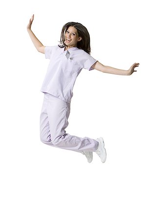 simsearch:640-01364042,k - Portrait of a female nurse jumping Stock Photo - Premium Royalty-Free, Code: 640-01359631