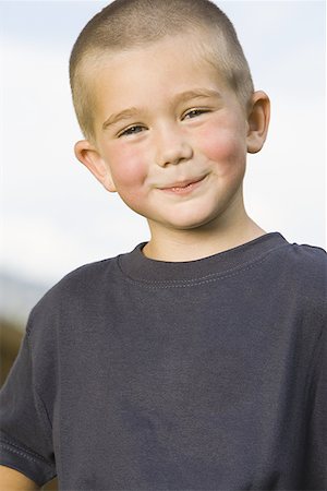 Portrait of a boy smiling Stock Photo - Premium Royalty-Free, Code: 640-01359699