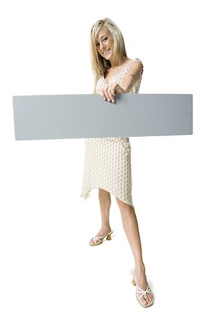 simsearch:640-01349238,k - Portrait of a young woman holding a blank sign Stock Photo - Premium Royalty-Free, Code: 640-01359885