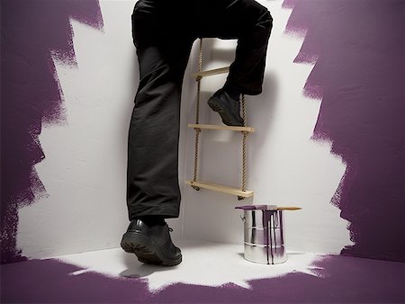 simsearch:640-01357365,k - Low section view of a mid adult man climbing a ladder Stock Photo - Premium Royalty-Free, Code: 640-01359928