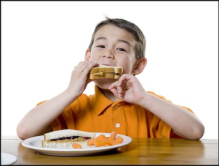 six people holding hands - Portrait of a boy eating a sandwich Stock Photo - Premium Royalty-Free, Code: 640-01359959