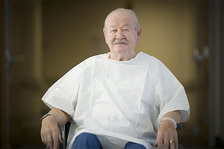 Portrait of a male patient sitting in a wheel chair Stock Photo - Premium Royalty-Free, Code: 640-01350139