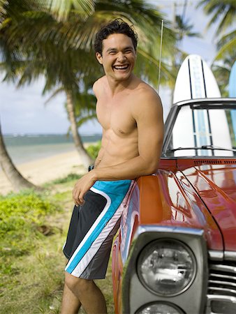 surfboard close up - Young man leaning against a car Stock Photo - Premium Royalty-Free, Code: 640-01350172