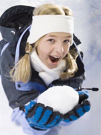 simsearch:400-04847852,k - Portrait of a girl holding a snowball Stock Photo - Premium Royalty-Free, Code: 640-01350198