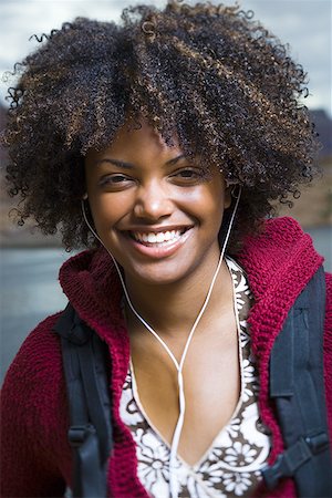 simsearch:640-01358229,k - Close-up of a young woman smiling Stock Photo - Premium Royalty-Free, Code: 640-01350277