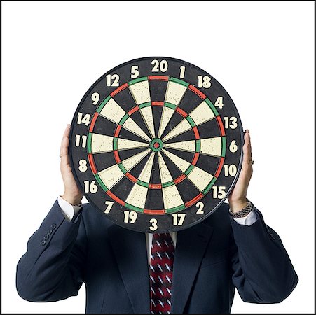 darts - Man with dartboard hiding face Stock Photo - Premium Royalty-Free, Code: 640-01350280
