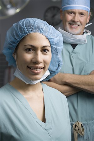 simsearch:640-01364042,k - Portrait of a female surgeon and a male surgeon smiling Stock Photo - Premium Royalty-Free, Code: 640-01350330