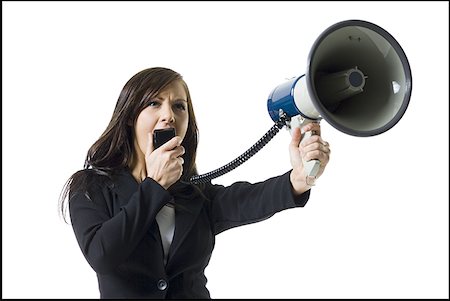 Close-up of a teenage girl shouting into a megaphone Stock Photo - Premium Royalty-Free, Code: 640-01350628