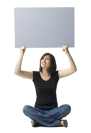 simsearch:640-01364042,k - Young woman holding a blank sign Stock Photo - Premium Royalty-Free, Code: 640-01350642