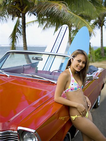 surfboard close up - Portrait of a young woman leaning against a car Stock Photo - Premium Royalty-Free, Code: 640-01350777