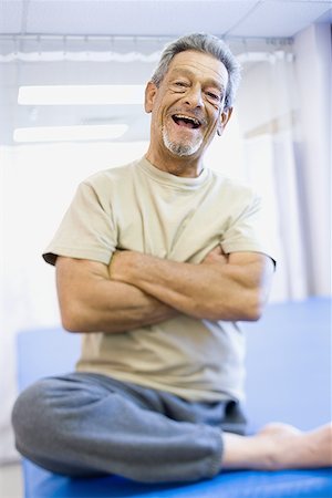 Portrait of a physically challenged senior man laughing Stock Photo - Premium Royalty-Free, Code: 640-01351164