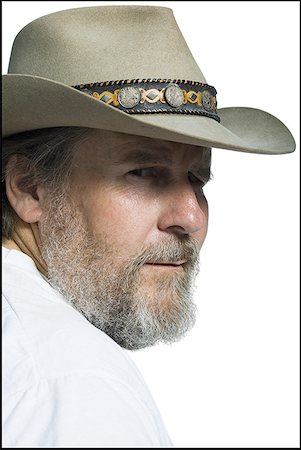 Gros plan d'un homme d'âge mûr coiffé d'un chapeau de cowboy Photographie de stock - Premium Libres de Droits, Code: 640-01351427