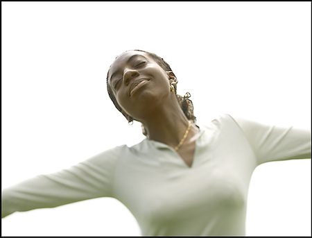 Close-up of a young woman with her arms outstretched Stock Photo - Premium Royalty-Free, Code: 640-01351552