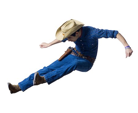 Man in cowboy costume falling Stock Photo - Premium Royalty-Free, Code: 640-01351646