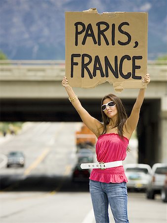 drifter - Woman hitchhiking a ride to Paris Stock Photo - Premium Royalty-Free, Code: 640-01351692