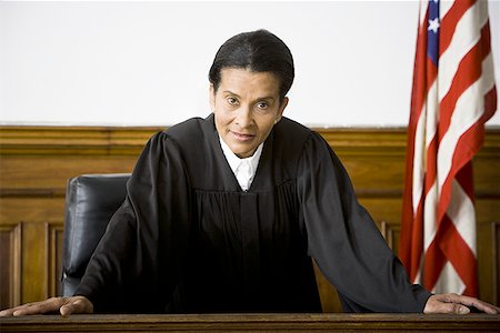 simsearch:640-01350504,k - Portrait of a female judge leaning against a bench Foto de stock - Sin royalties Premium, Código: 640-01352027