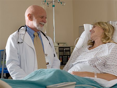 Male doctor talking to a female patient Stock Photo - Premium Royalty-Free, Code: 640-01352021