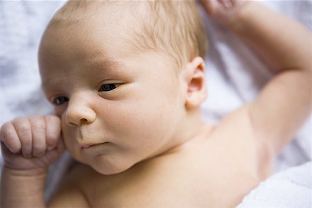 Newborn baby lying down Stock Photo - Premium Royalty-Free, Code: 640-01352137