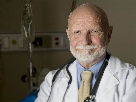 Portrait of a male doctor smiling Stock Photo - Premium Royalty-Free, Code: 640-01352138