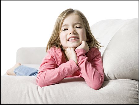 simsearch:640-01351381,k - Portrait d'une jeune fille allongée sur un canapé Photographie de stock - Premium Libres de Droits, Code: 640-01352161