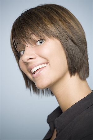Close-up of a teenage girl smiling Stock Photo - Premium Royalty-Free, Code: 640-01352218