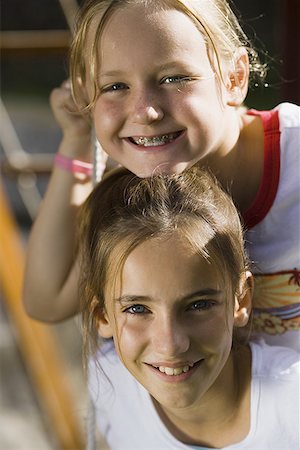 simsearch:640-01357979,k - Portrait of two girls sitting on a swing Stock Photo - Premium Royalty-Free, Code: 640-01352226