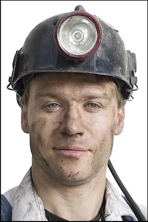 Portrait of a coal miner wearing a hardhat Stock Photo - Premium Royalty-Free, Code: 640-01352240