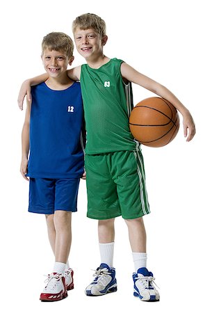 Young boys playing basketball Stock Photo - Premium Royalty-Free, Code: 640-01352371