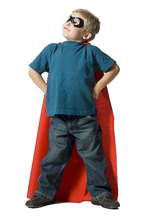 Young boy in superhero costume Stock Photo - Premium Royalty-Free, Code: 640-01352403