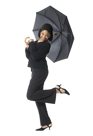 Portrait of a teenage girl holding an umbrella Stock Photo - Premium Royalty-Free, Code: 640-01352511