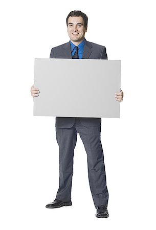 simsearch:640-01349238,k - Businessman holding a blank sign Stock Photo - Premium Royalty-Free, Code: 640-01352777