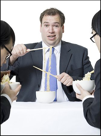 simsearch:640-01350815,k - Close-up of three businessmen eating noodles Stock Photo - Premium Royalty-Free, Code: 640-01352987