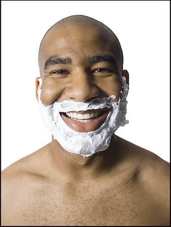 Man with shaving lotion on face Stock Photo - Premium Royalty-Free, Code: 640-01353202