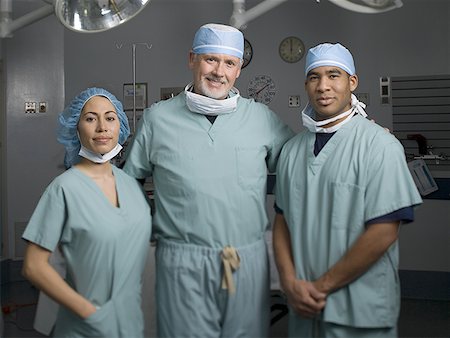 simsearch:640-01364042,k - Portrait of three surgeons in an operating room Stock Photo - Premium Royalty-Free, Code: 640-01353760