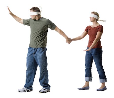 enigma - Blindfolded young man leading to a blindfolded young woman Stock Photo - Premium Royalty-Free, Code: 640-01353910