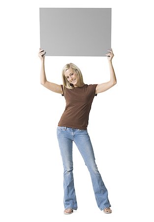 simsearch:640-01349238,k - Portrait of a young woman lifting up a blank sign Stock Photo - Premium Royalty-Free, Code: 640-01364062