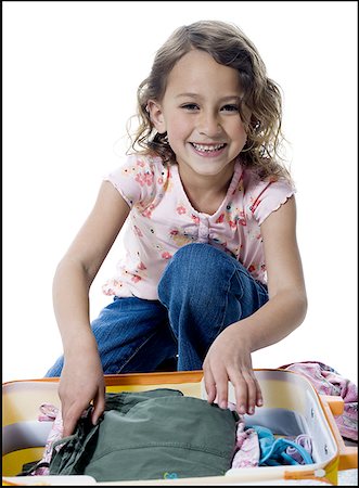 simsearch:640-01357979,k - Portrait of a girl packing a suitcase Stock Photo - Premium Royalty-Free, Code: 640-01364130