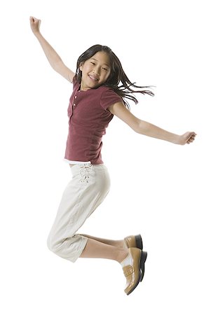 simsearch:640-01365707,k - Portrait of a teenage girl jumping with her arms outstretched Stock Photo - Premium Royalty-Free, Code: 640-01364220