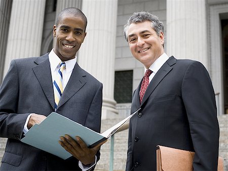simsearch:640-01351636,k - Low angle view of two lawyers smiling Stock Photo - Premium Royalty-Free, Code: 640-01364253